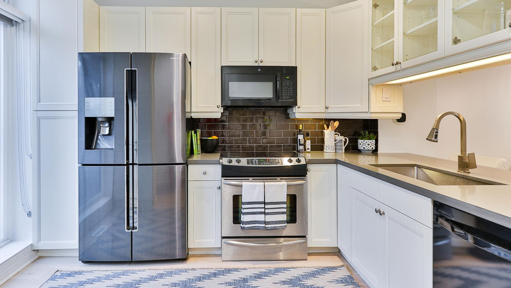 Clean, modern-looking kitchen with a double door refrigerator